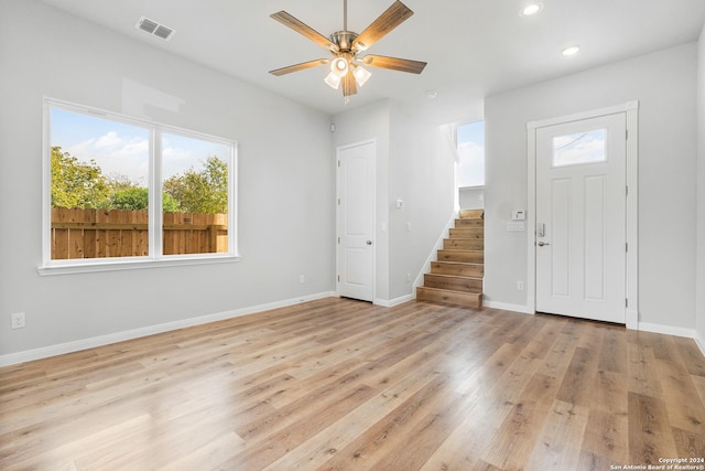 entryway featuring ceiling fan, light hardwood / wood-style floors, and a wealth of natural light