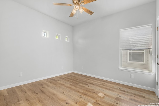 spare room with ceiling fan and light hardwood / wood-style floors