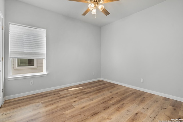 empty room featuring light wood-type flooring and ceiling fan