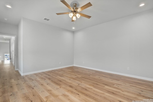 unfurnished room featuring light hardwood / wood-style floors and ceiling fan