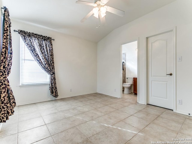 spare room featuring light tile patterned floors, ceiling fan, and lofted ceiling