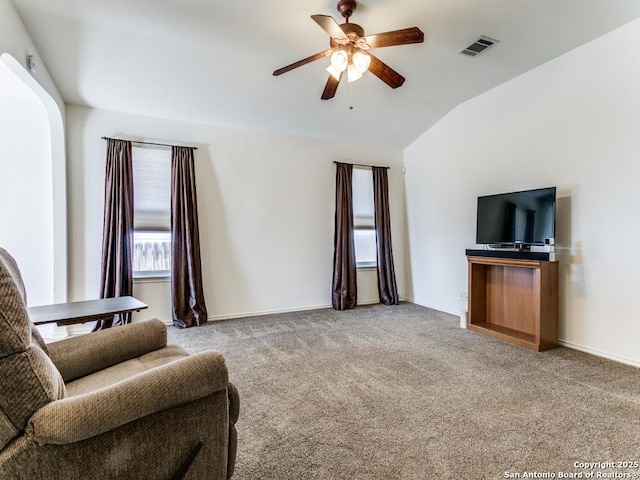 sitting room featuring carpet, ceiling fan, and lofted ceiling