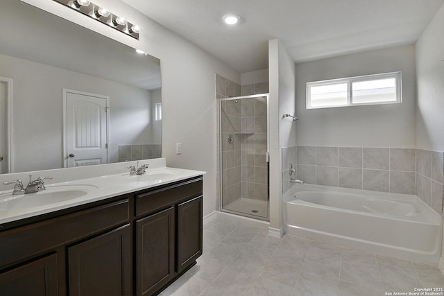 bathroom with vanity, tile patterned floors, and independent shower and bath