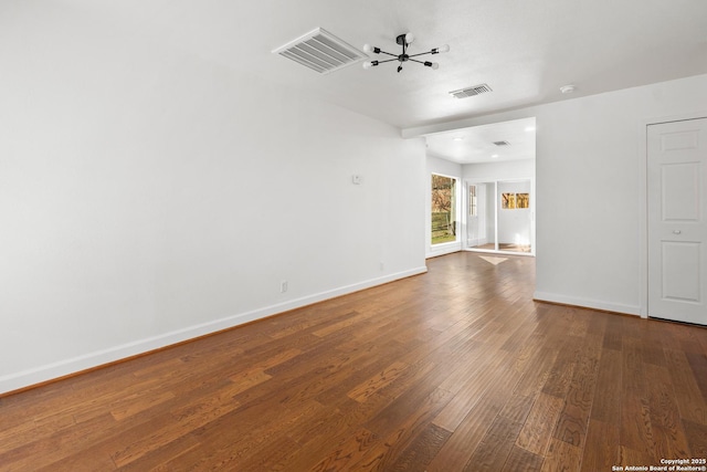 spare room featuring dark hardwood / wood-style flooring