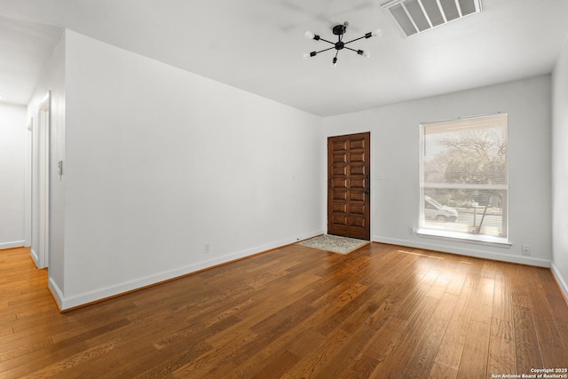 spare room featuring hardwood / wood-style flooring