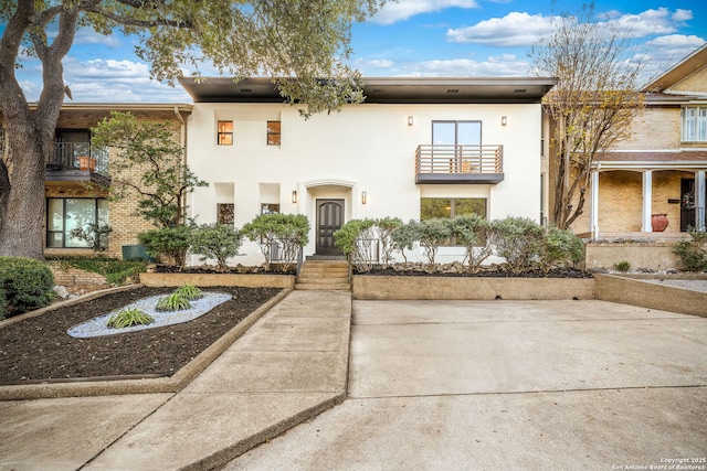 multi unit property featuring a balcony