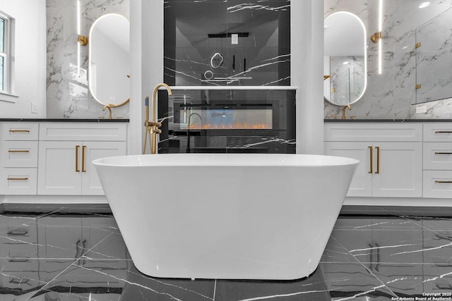 bathroom with vanity and a bathing tub