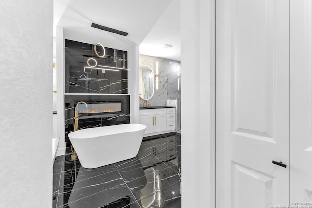 bathroom with vanity and a bathtub