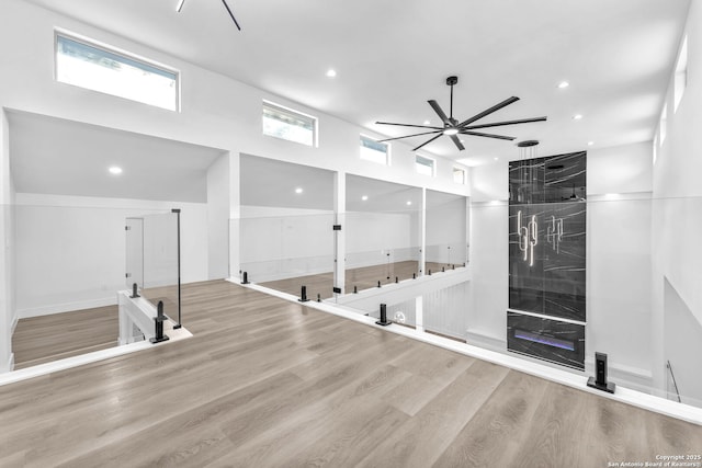 interior space with ceiling fan and light wood-type flooring