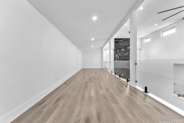 additional living space featuring light hardwood / wood-style flooring