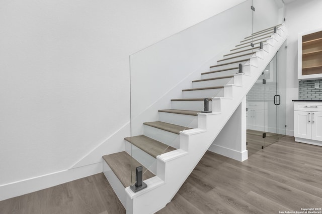 staircase featuring hardwood / wood-style flooring