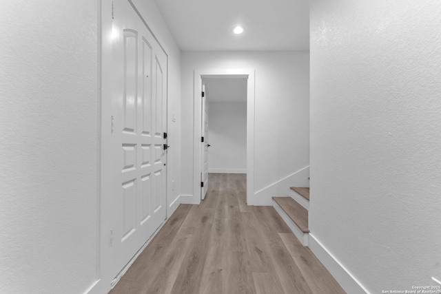 hallway with light wood-type flooring