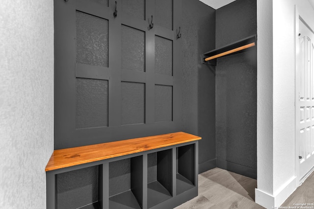 mudroom with light hardwood / wood-style floors