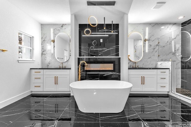 bathroom featuring separate shower and tub and vanity