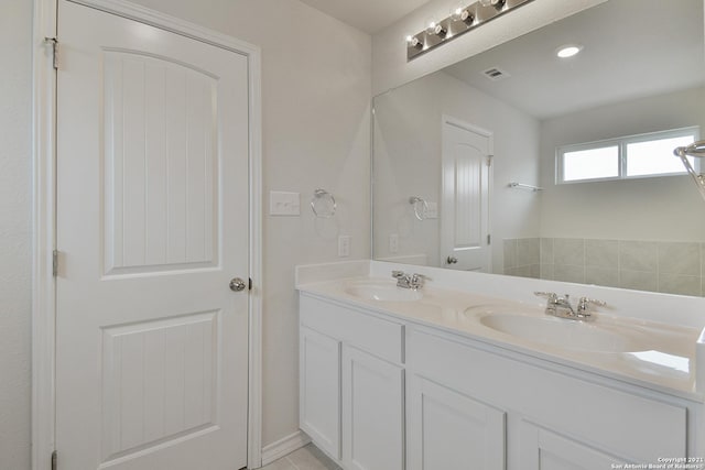 bathroom with tile patterned flooring and vanity