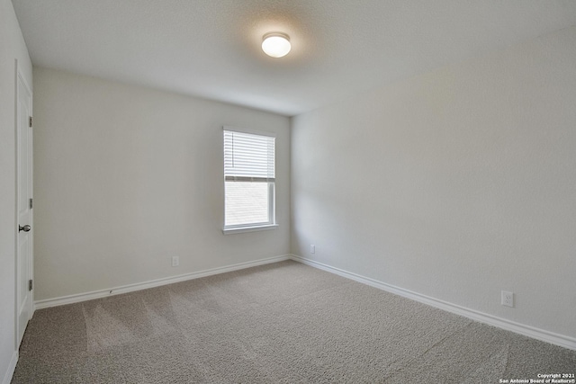 empty room featuring carpet flooring