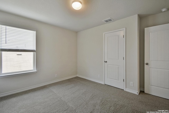 spare room with light colored carpet