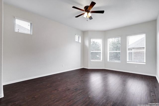 unfurnished room featuring ceiling fan and dark hardwood / wood-style floors