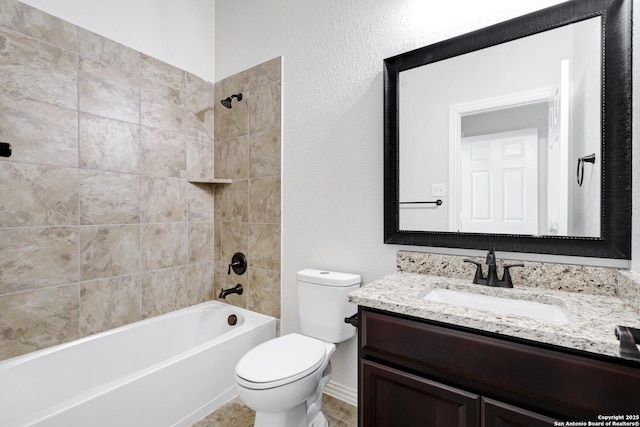 full bathroom featuring vanity, toilet, and tiled shower / bath