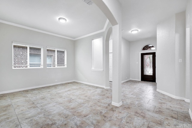 foyer entrance featuring crown molding