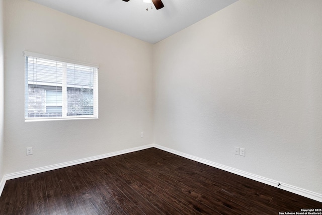 empty room with ceiling fan and wood-type flooring