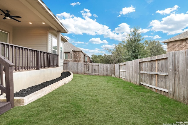 view of yard featuring ceiling fan