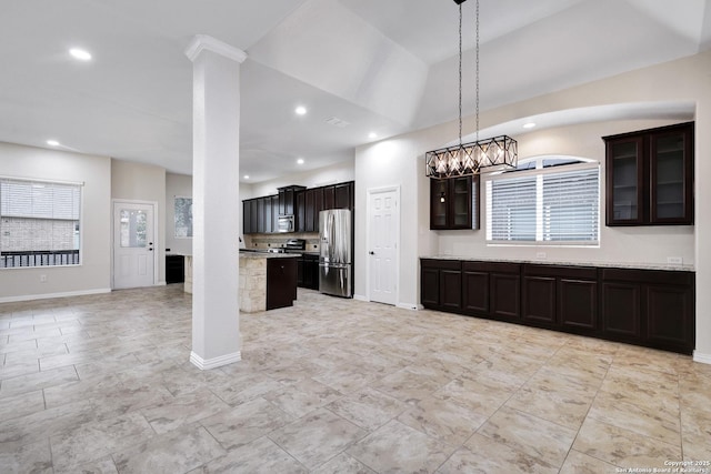 kitchen with dark brown cabinets, a center island, stainless steel appliances, and decorative light fixtures