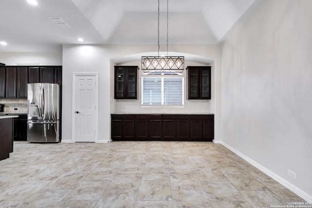 unfurnished dining area with lofted ceiling