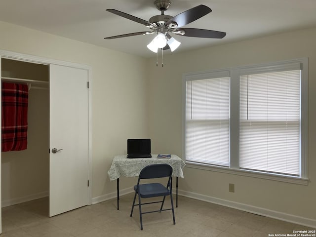 home office featuring a wealth of natural light and ceiling fan