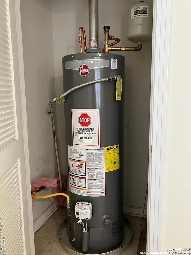 utility room with gas water heater