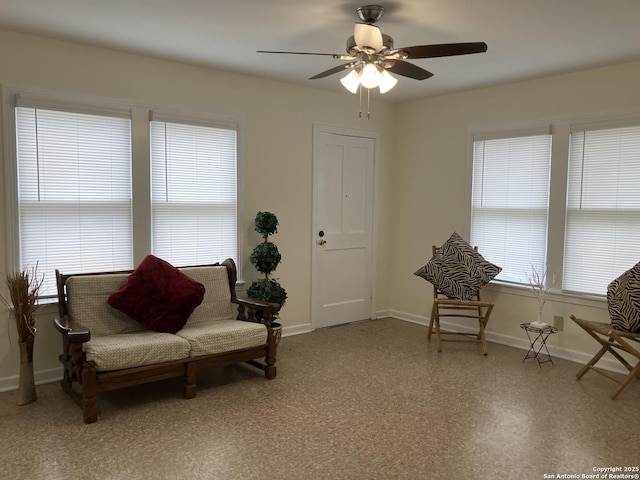 sitting room with ceiling fan