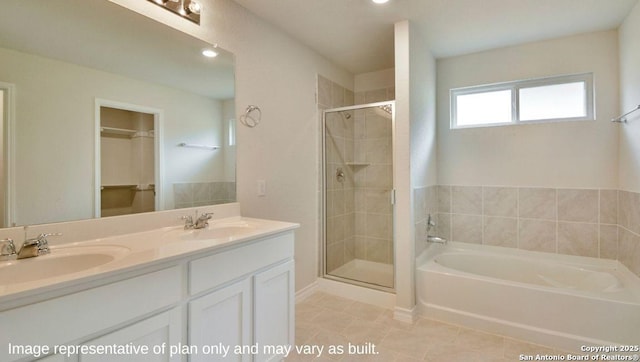 bathroom featuring tile patterned floors, vanity, and separate shower and tub