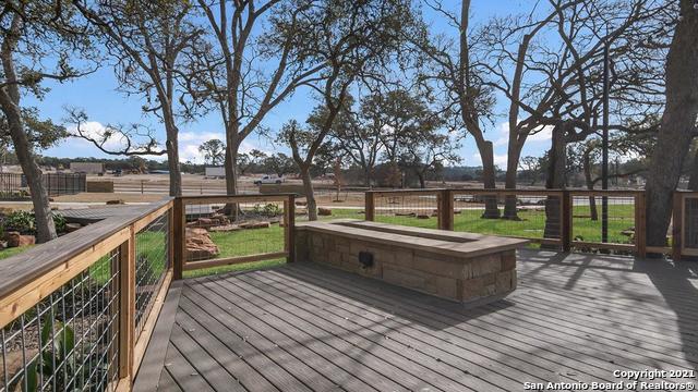 wooden deck featuring a rural view