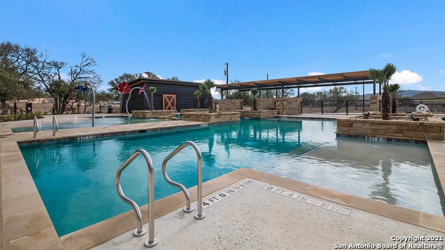 view of pool featuring a patio area