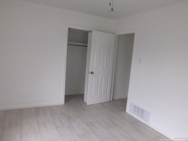 unfurnished bedroom with a closet