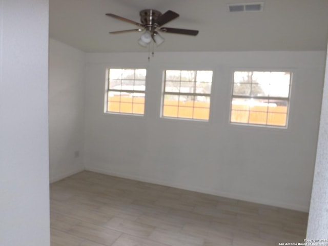 unfurnished room with ceiling fan