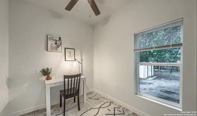 home office featuring vaulted ceiling and ceiling fan