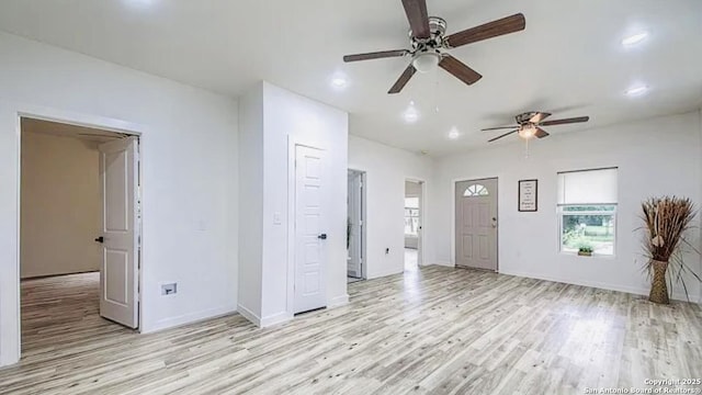 interior space with ceiling fan and light wood-type flooring