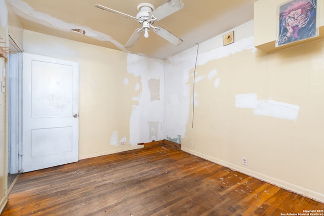 unfurnished room featuring dark hardwood / wood-style flooring and ceiling fan