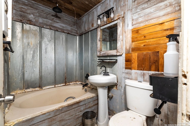 bathroom featuring wood walls, wooden ceiling, and toilet