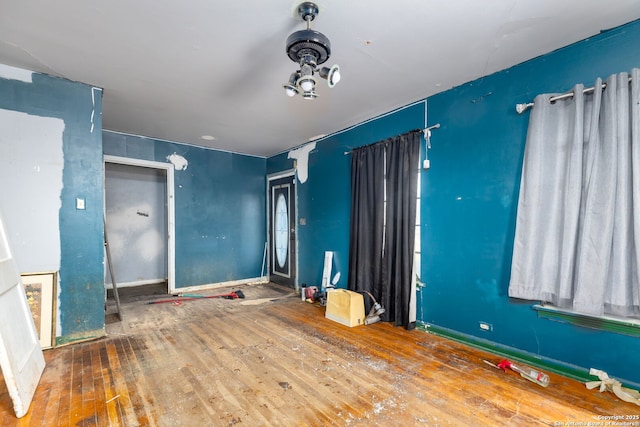 unfurnished bedroom with wood-type flooring