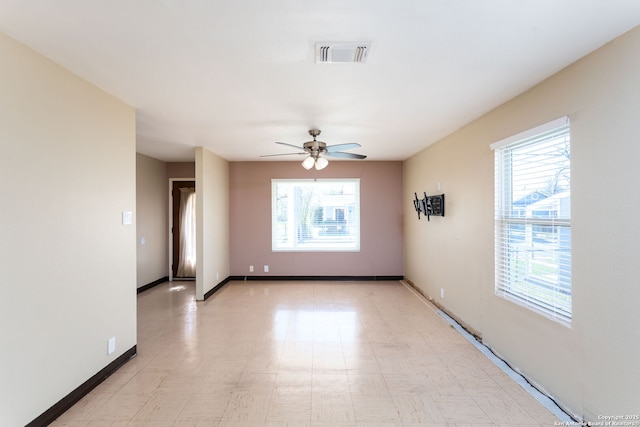 spare room with ceiling fan