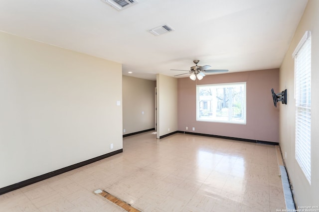 spare room featuring ceiling fan