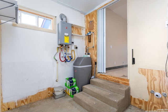 utility room featuring tankless water heater