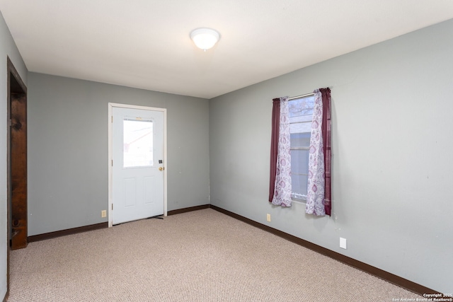 unfurnished room featuring carpet flooring and a wealth of natural light