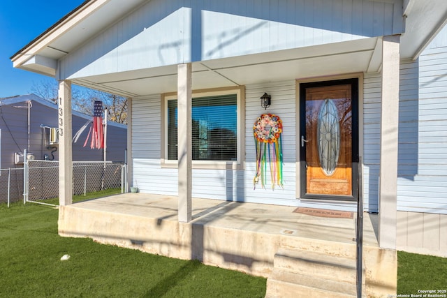 entrance to property featuring covered porch