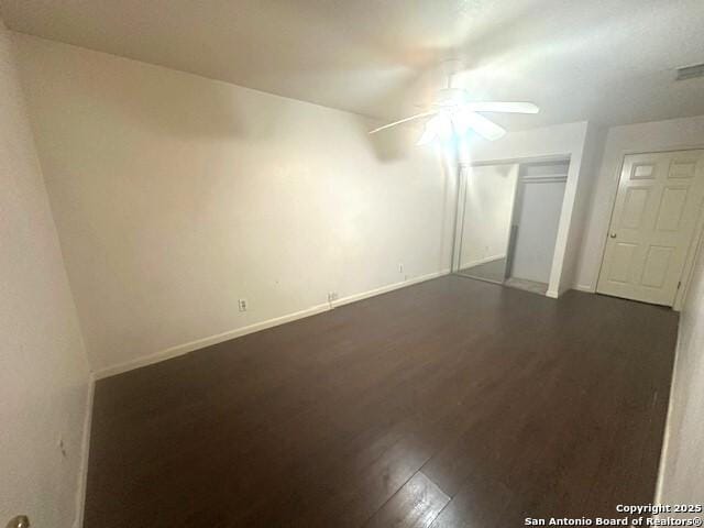 bonus room featuring ceiling fan and dark wood-type flooring