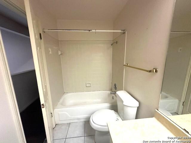 full bathroom featuring tile patterned flooring, vanity, toilet, and shower / bathtub combination