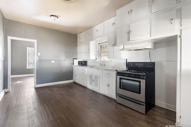 kitchen featuring stainless steel electric range oven, dark hardwood / wood-style flooring, white cabinets, and sink