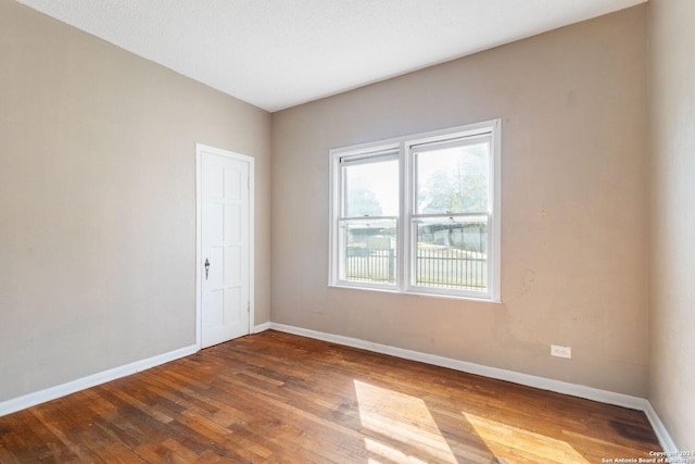 empty room featuring hardwood / wood-style floors